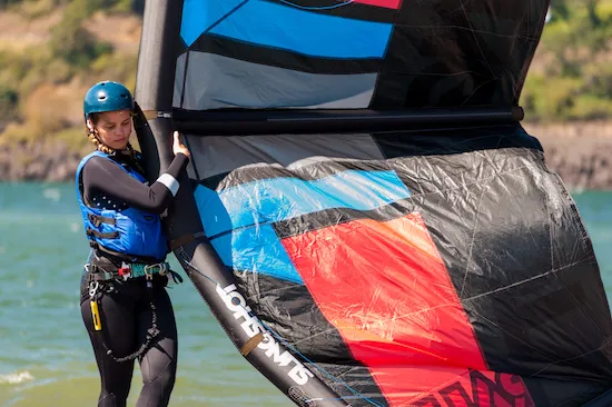 Student launches kite at Hood River sandbar